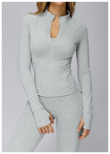 Close-up of lightweight grey thermal zip jacket fabric texture with functional thumb holes