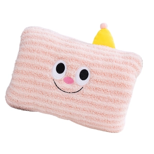 Pink striped plush hand warmer pillow with a cute cartoon face and yellow top accent