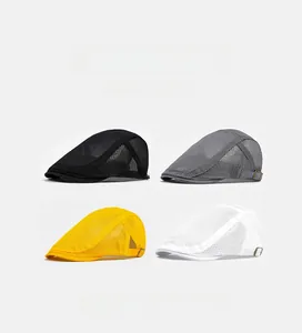 Detail of mesh flat caps showing breathable fabric and adjustable metal side buckles