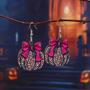 Boucles d'oreilles citrouille en bois imprimé léopard avec nœud rose à paillettes
