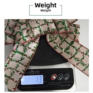 Weight detail of 13g Christmas burlap bow featuring pine needle and red plaid prints