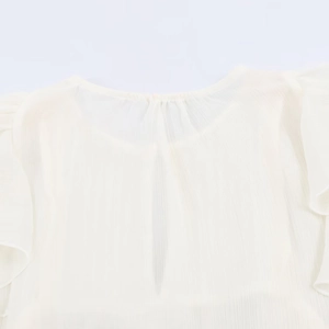 Detail of cream pleated women's blouse featuring a round neckline and vertical slit