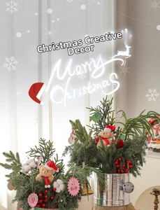 Miniature Christmas trees with bears and red berries in silver pots for table decor