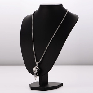 Polished stainless steel crow skull pendant necklace on a round box chain for men