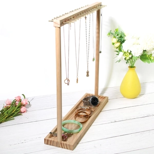 Natural wood jewelry display stand with metal hooks and a rectangular storage base tray