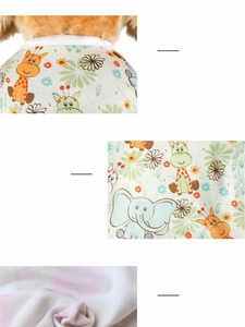 Detailed view of soft polyester pet vest fabric with cartoon giraffe and elephant prints
