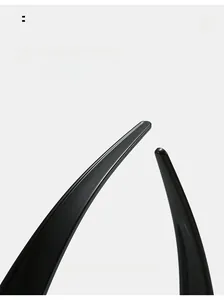 Detail of curved ergonomic temple arms on glossy black Y2K sports sunglasses
