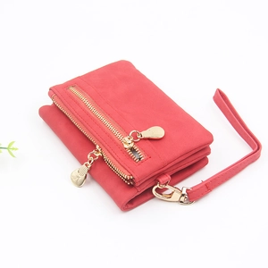 Detail view of red PU leather wallet with gold double zippers and a detachable wristlet