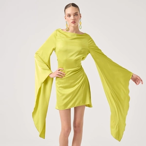 Elegant lime green satin mini dress with long flared sleeves and flattering ruched details