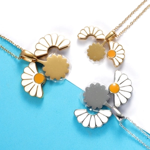 Minimalist titanium daisy flower necklaces in gold and silver finish with white petals