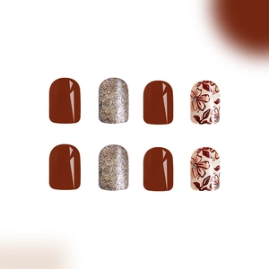 Short glossy brown and gold glitter press-on nails with floral patterns, 24 pieces