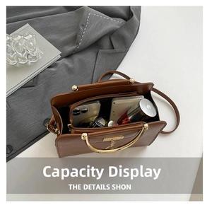 Interior view showing the large capacity and compartments of the brown leather handbag