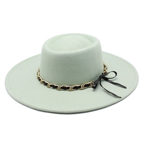 Detail of light green wool felt hat featuring a decorative gold chain and black bow