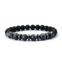 Detail of matte black beads with grey marble accent stones and silver metal spacers