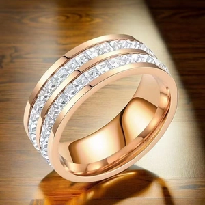 Close-up of rose gold stainless steel ring with double-row sparkling crystals inlay