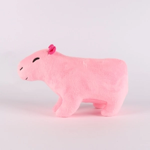 Side view of soft pink capybara plush toy with cute features and smooth short fur