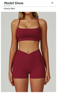 Detail of cherry red yoga bra and V-cross waistband shorts with functional side pockets