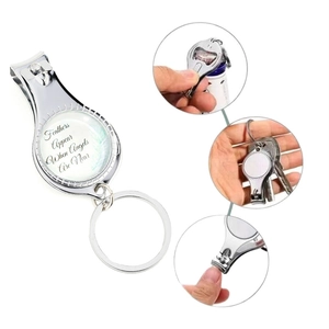 Silver dual-use nail clipper keychain with inspirational glass dome text on white background