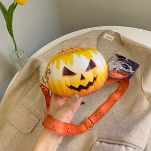 Close-up of Halloween pumpkin round crossbody bag with Jack-o'-lantern face and striped strap