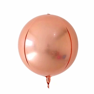 Macro shot of a rose gold spherical 4D aluminum foil balloon with metallic finish