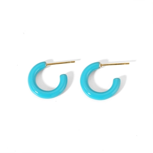 Minimalist C-shaped hoop earrings in bright blue resin with gold posts on white background
