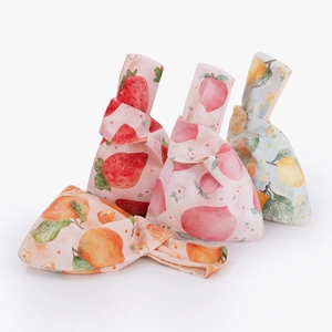 Velvet knot wrist bags with watercolor strawberry, peach, lemon, and orange fruit prints