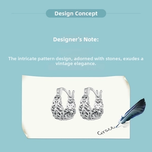 Detail view of S925 sterling silver hoop earrings with hollow retro pattern and small stones