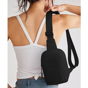 Versatile black crossbody bag with adjustable strap worn on the back for casual use