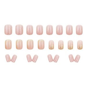 Nude pink press-on nails set with glitter gradient and shimmering diamond finish