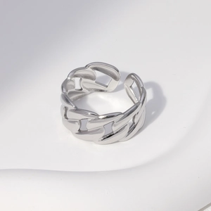 Detailed view of silver chain link ring with adjustable open band in polished steel