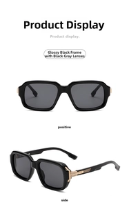 Close-up of retro aviator sunglasses with black frames and gold metal accents