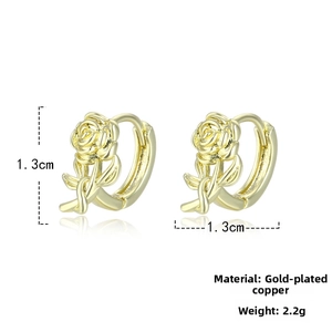 Detailed macro view of 18K gold plated copper rose earrings with intricate petal texture