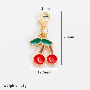 Detailed dimension view of cherry enamel charm with lobster clasp measuring 29mm by 12.5mm