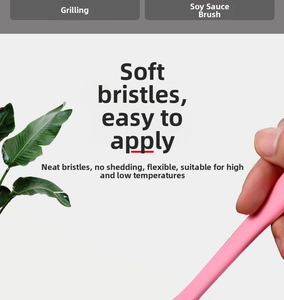 Close-up of pink silicone basting brush with soft bristles for BBQ and home baking