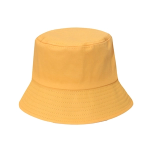 Detailed view of yellow bucket hat featuring reinforced brim stitching and cotton fabric