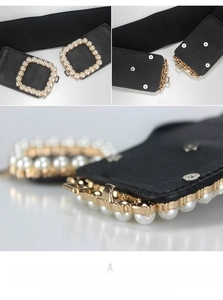 Detail of elastic waist belt with vintage square buckle and faux pearl inlay