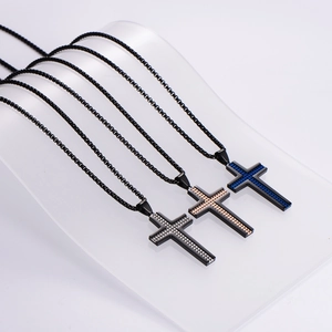 Three stainless steel cross necklaces with textured studs in silver, gold, and blue colors