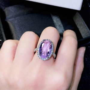 Oval purple amethyst ring with micro-pave cubic zirconia on an elegant silver band
