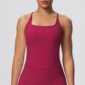 Detail of burgundy sports bra with thin straps and square neckline on model