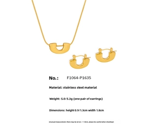 Macro shot of 18k gold plated stainless steel U-shaped pendant necklace and earrings set