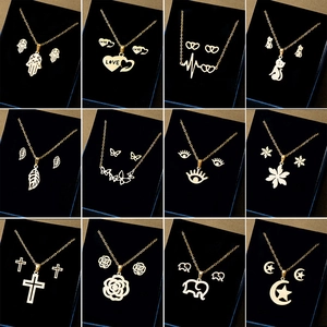 12-pack golden stainless steel jewelry sets with heart, love, and floral motifs