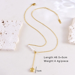 Detailed view of golden pendant necklace with Fu character, pearls and product dimensions