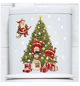 Detail of Santa and Snowman Christmas decals applied on a white bathroom toilet tank