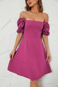 Close-up of the square neck and puff sleeve detail on this magenta summer dress