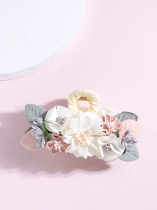 Detail of Korean fabric floral hair claw clip with cream roses and plaid ribbon handle