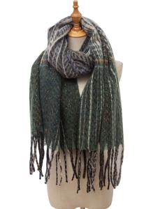 Close-up of green checkered scarf with fringe detail and colorful accents on a wooden mannequin
