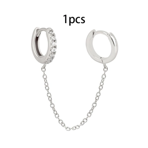Detailed view of silver double-piercing chain earring with white zircon inlay