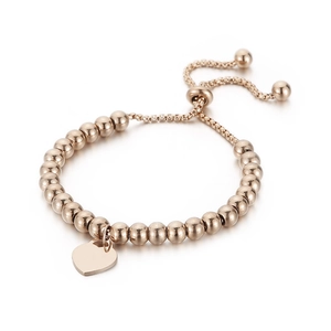 Elegant rose gold beaded bracelet with a polished heart pendant and adjustable drawstring