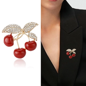 Red enamel cherry brooch with crystal leaf design on gold metal base for women
