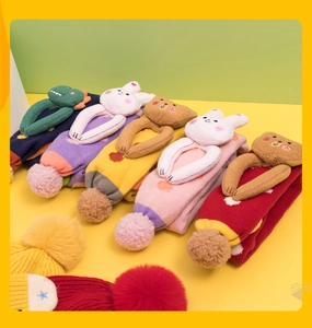 Close-up of children's thick knit floor socks with cute 3D plush animal decorations